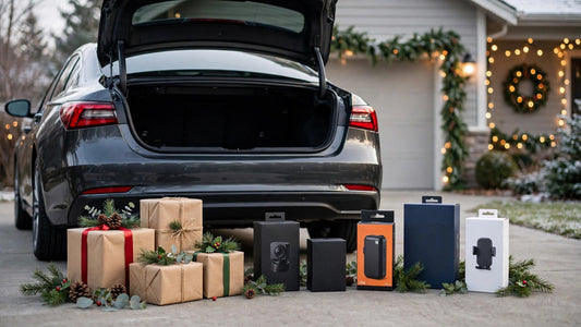 Holiday gift guide 2026: gift boxes and car accessories arranged around a car in a festive winter setting